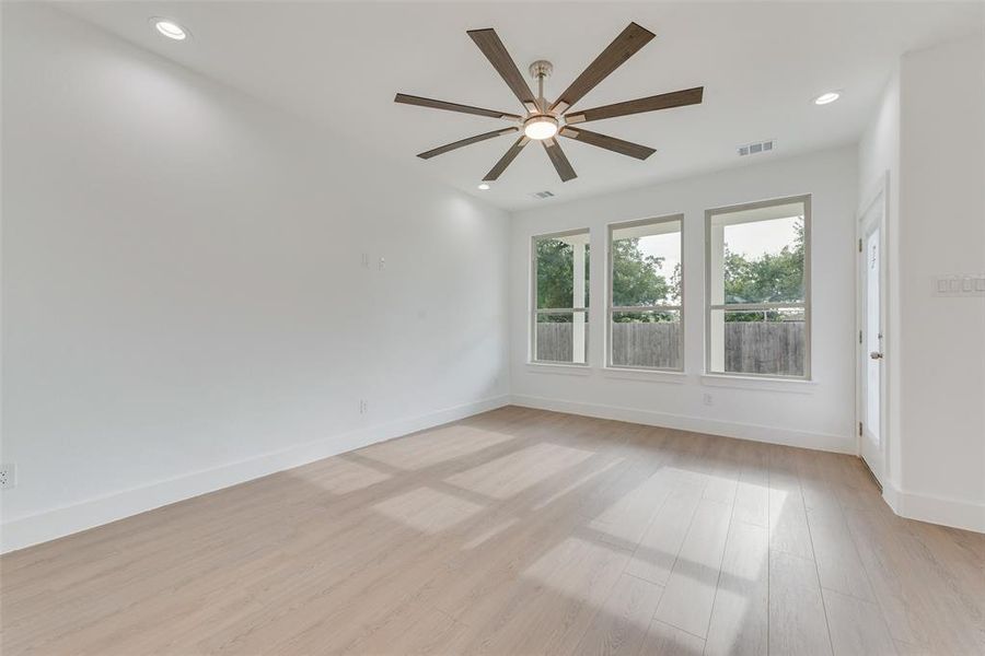 Empty room featuring light wood-type flooring, recessed lighting, and ceiling fan Empty room featuring light wood-type flooring, recessed lighting, and ceiling fan