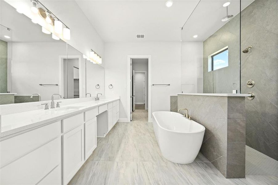 Beautiful Master luxury bathroom. Lots of countertop space, Large stand alone tub, full walk thru shower with rain head and regular shower head for relaxing under the water.