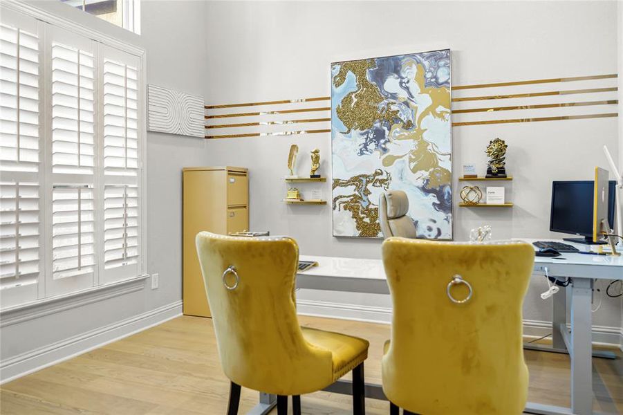 Dining space featuring a desk and light wood-type flooring Dining space featuring a desk and light wood-type flooring