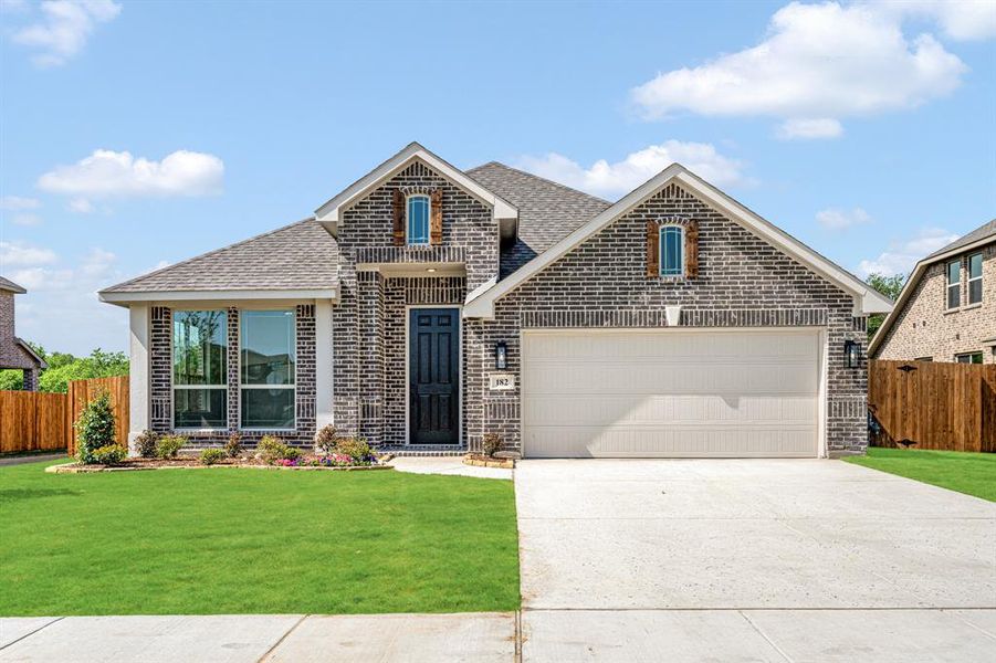 Front exterior of a new home in Sable Creek, Sanger, TX, highlighting curb appeal (Image 23). Front exterior of a new home in Sable Creek, Sanger, TX, highlighting curb appeal (Image 23).