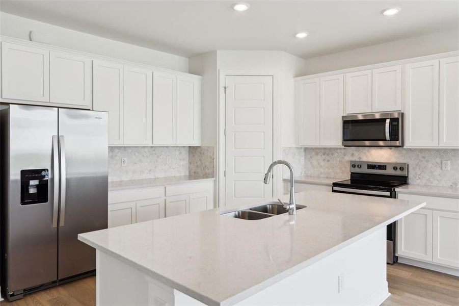 Furnished interior view inside a new home in Crescent Lakes - Reserve Series, Punta Gorda (Image 3). Furnished interior view inside a new home in Crescent Lakes - Reserve Series, Punta Gorda (Image 3).