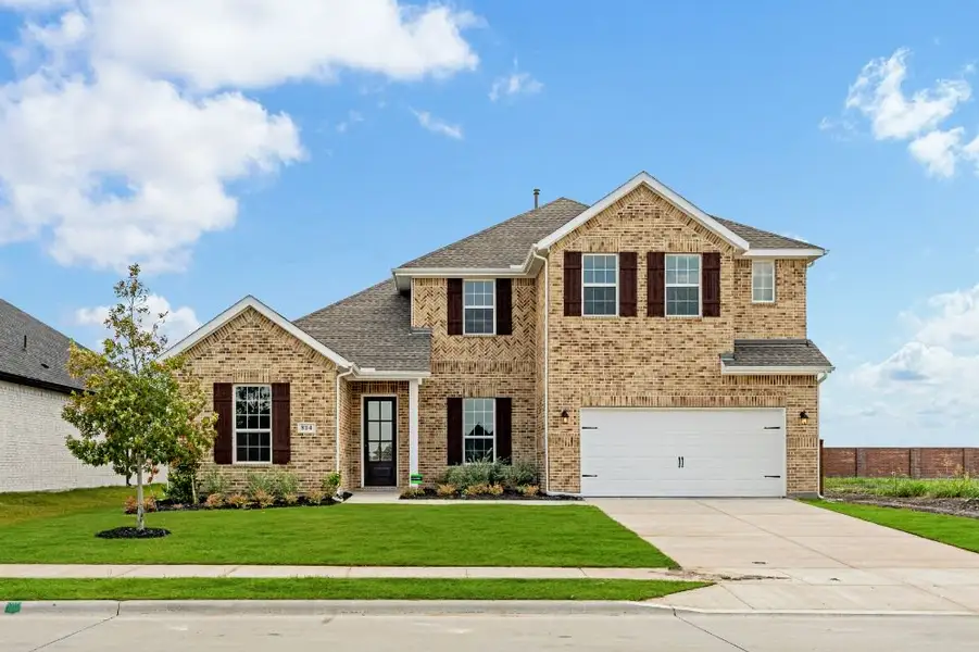 Representative exterior photo of a completed home built from the Whitney by UnionMain Homes in Edgewater, Fate, TX (Image 3). Representative exterior photo of a completed home built from the Whitney by UnionMain Homes in Edgewater, Fate, TX (Image 3).
