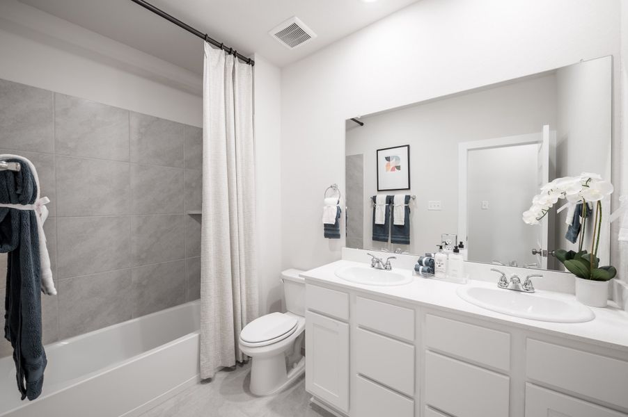 Representative furnished interior of a home built from the Caddo by Tri Pointe Homes in Mason Woods, Cypress (Image 15).