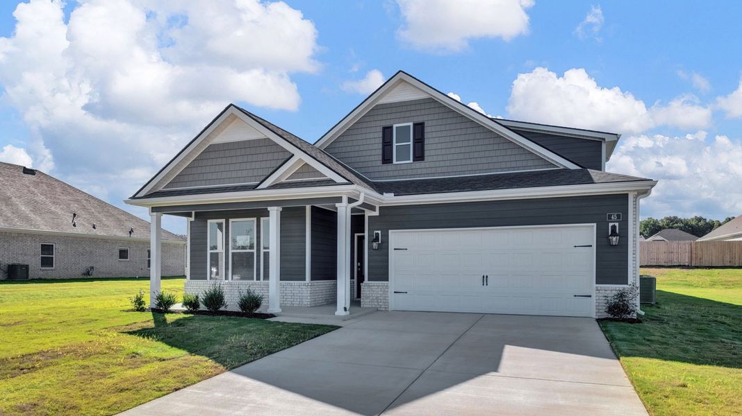Front exterior of a new home in The Orchard, Millington, TN, highlighting curb appeal (Image 22).