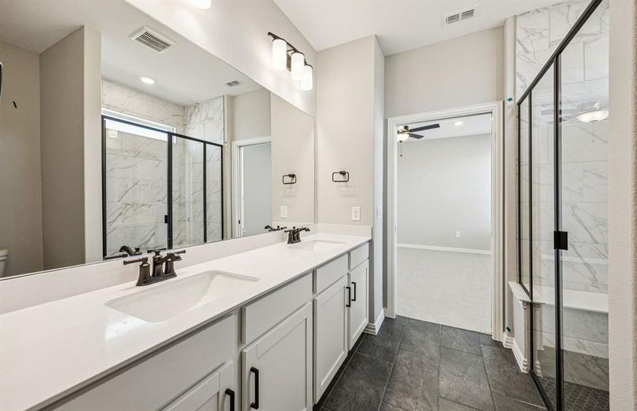 Owner's bath with large shower, tub, and double vanity Owner's bath with large shower, tub, and double vanity