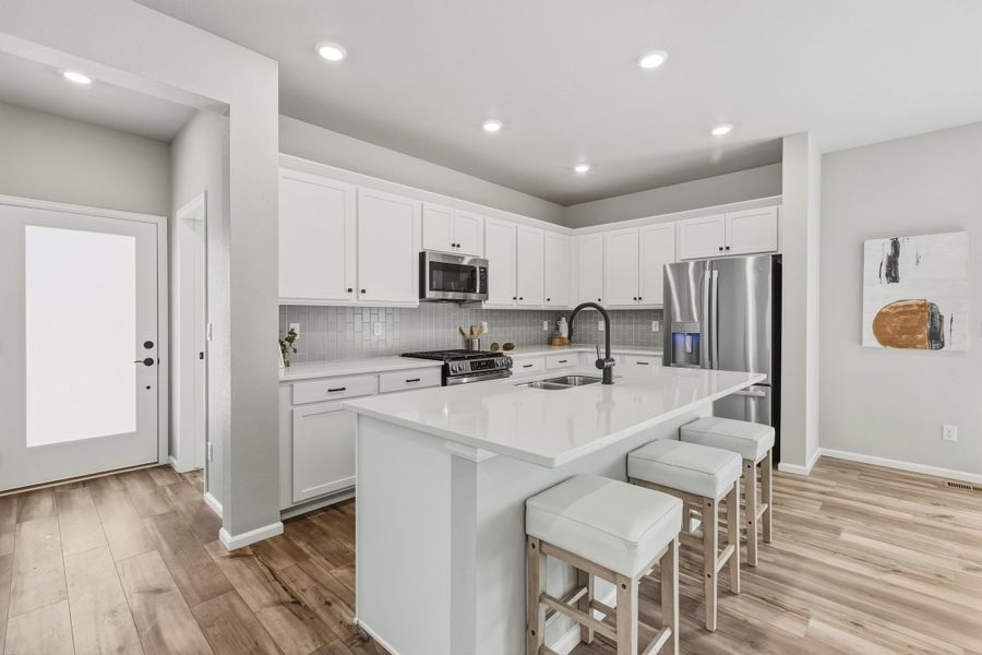 Furnished interior view inside a new home in Woodrose at Painted Prairie, Aurora (Image 4).