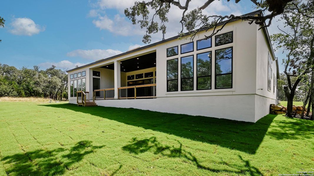 Front exterior of a new home in George's Ranch Acre, Boerne, TX, highlighting curb appeal (Image 23).