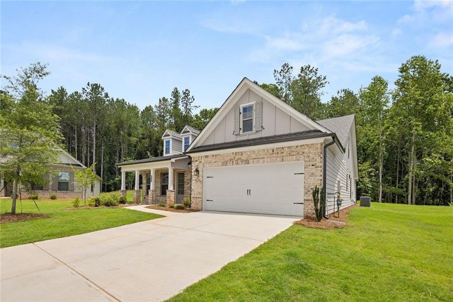 Front exterior of a new home in Soleil Belmont Park, Canton, GA, highlighting curb appeal (Image 1). Front exterior of a new home in Soleil Belmont Park, Canton, GA, highlighting curb appeal (Image 1).