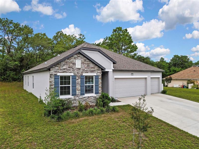 Front exterior of a new home in , Homosassa, FL, highlighting curb appeal (Image 24). Front exterior of a new home in , Homosassa, FL, highlighting curb appeal (Image 24).