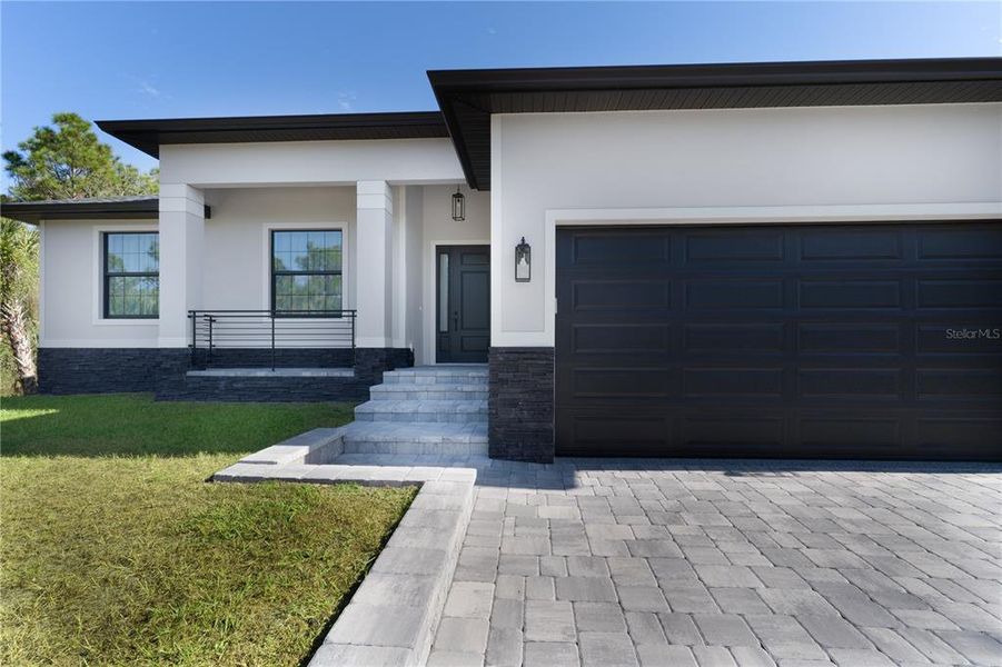 Front exterior of a new home in , Port Charlotte, FL, highlighting curb appeal (Image 24).