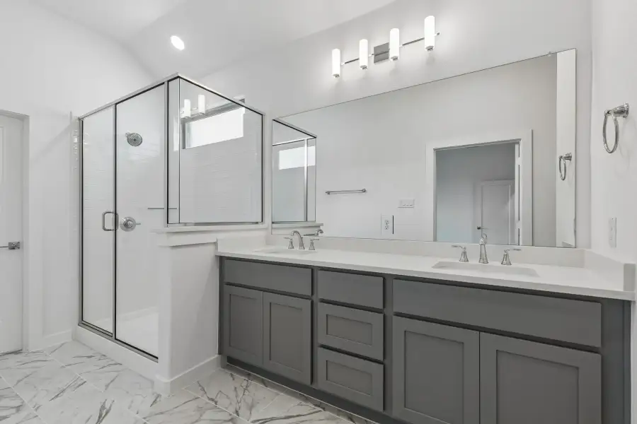 Primary Bathroom in the Claret home plan by Trophy Signature Homes – REPRESENTATIVE PHOTO