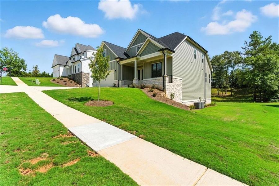 Front exterior of a new home in , Rome, GA, highlighting curb appeal (Image 27). Front exterior of a new home in , Rome, GA, highlighting curb appeal (Image 27).