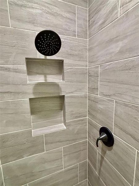 Bathroom view of a tile shower