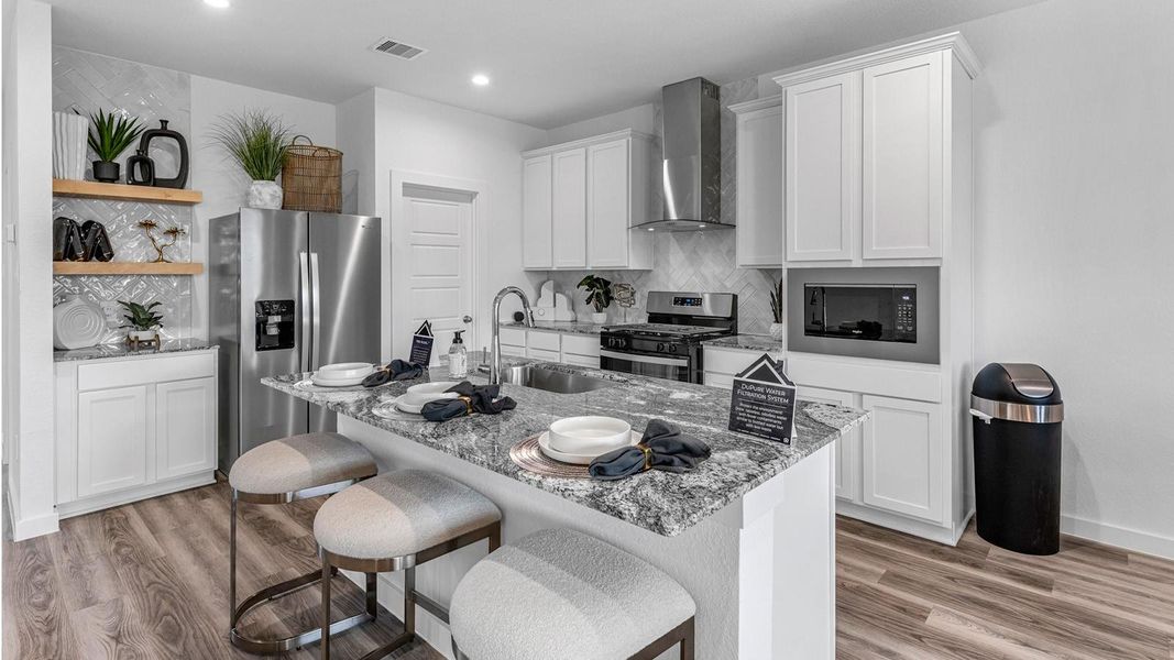 Representative photo. The kitchen serves as the heart of the home, seamlessly connecting to the dining and family areas creating an inviting environment for everything from casual evenings to entertaining guests. Representative photo. The kitchen serves as the heart of the home, seamlessly connecting to the dining and family areas creating an inviting environment for everything from casual evenings to entertaining guests.