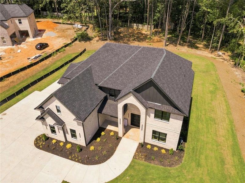 Front exterior of a new home in , Loganville, GA, highlighting curb appeal (Image 25).