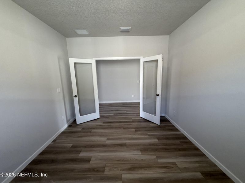 Spacious, unfurnished interior of a new home in The Cypress Series at Reserve East, Flagler Beach (Image 26).