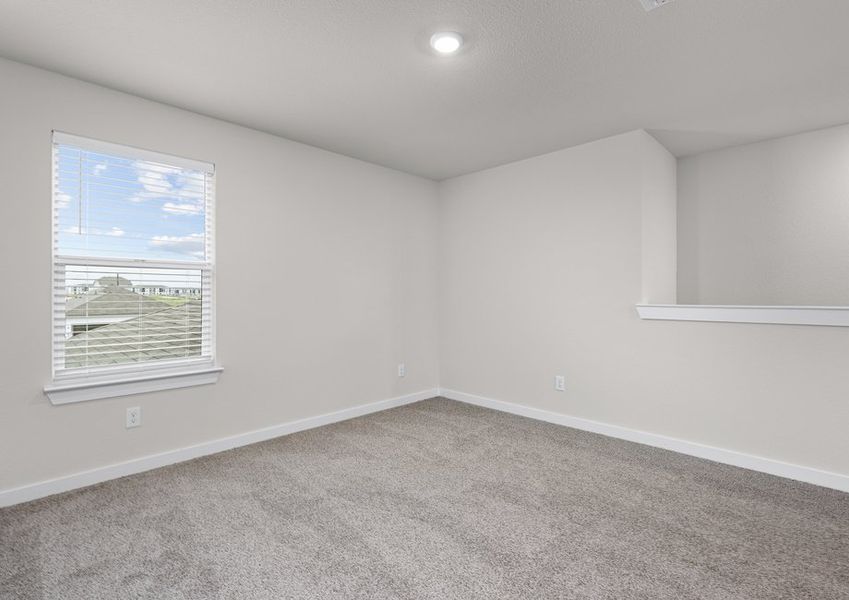 Upstairs, the spacious loft is a versatile space.