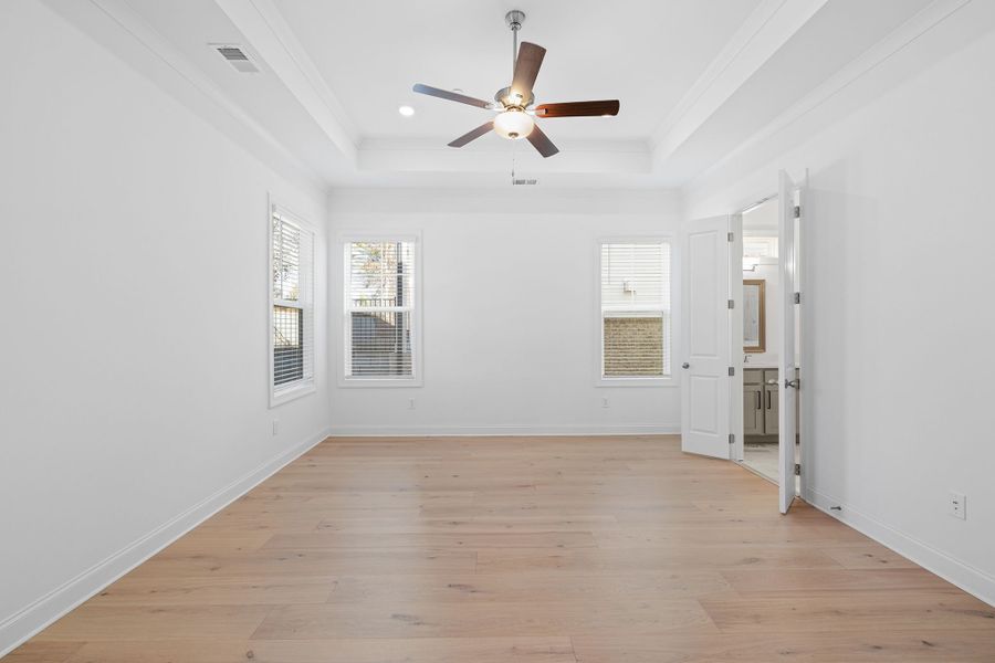 Master bedroom with sunny windows