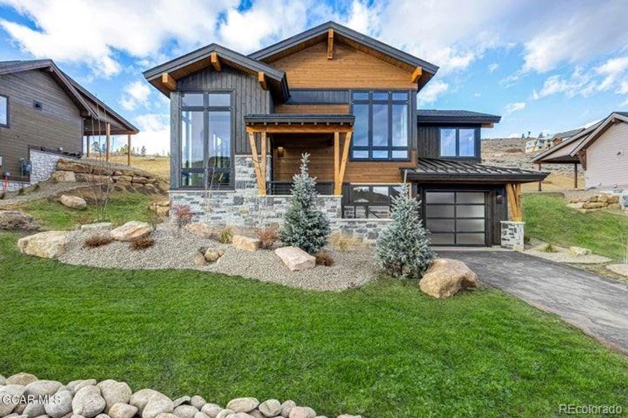 Front exterior of a new home in , Granby, CO, highlighting curb appeal (Image 1).