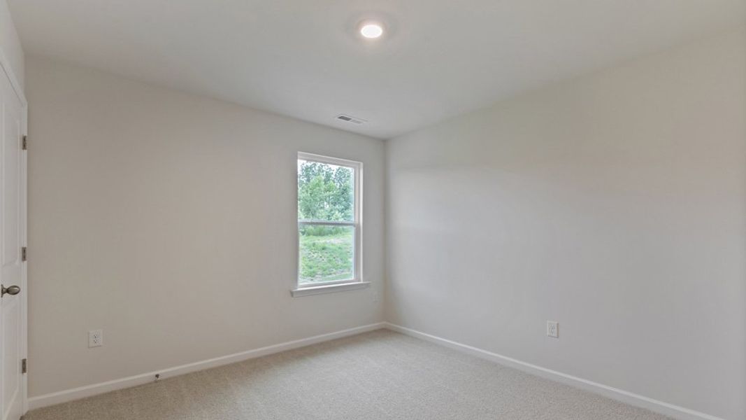 Spacious, unfurnished interior of a new home in The Grove at Matthews Landing, Fuquay Varina (Image 18).