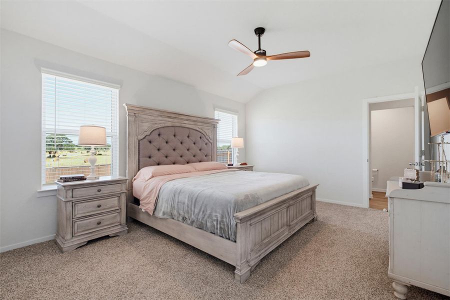 High ceilings and soft carpeting define this serene main floor bedroom retreat. High ceilings and soft carpeting define this serene main floor bedroom retreat.