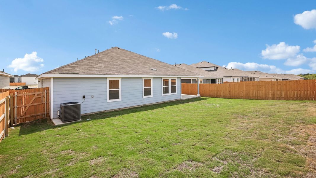 Exterior details and patio area of a home in Prairie Lakes, Buda (Image 4).
