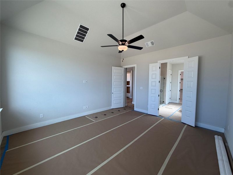 Primary Bedroom with elevated ceiling