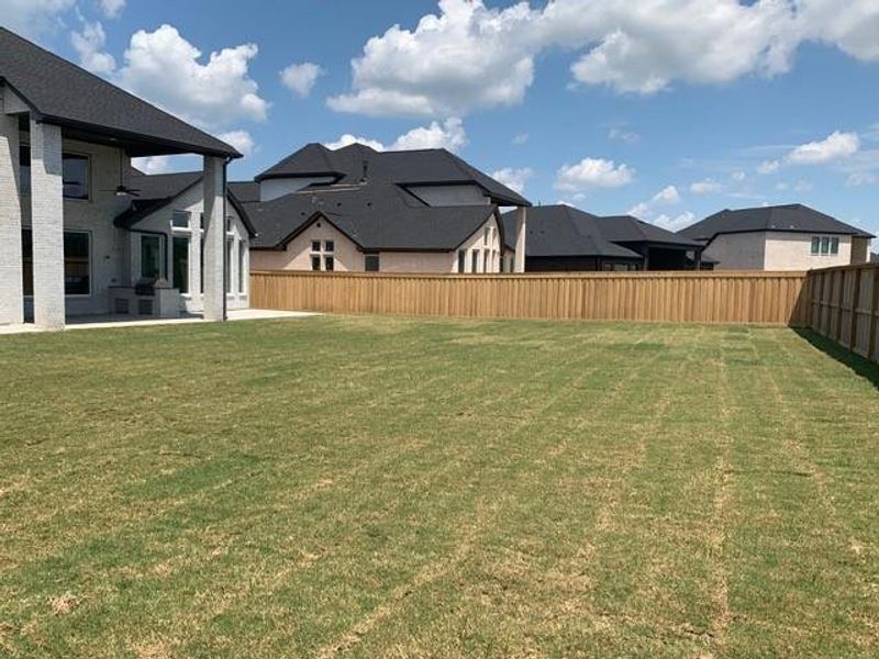 Exterior details and patio area of a home in Dunham Pointe, Cypress (Image 24).