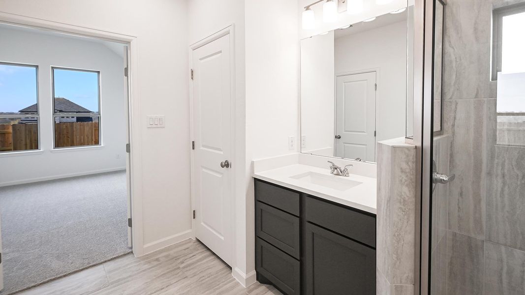 Furnished interior view inside a new home in Crosswinds 40', Kyle (Image 13).