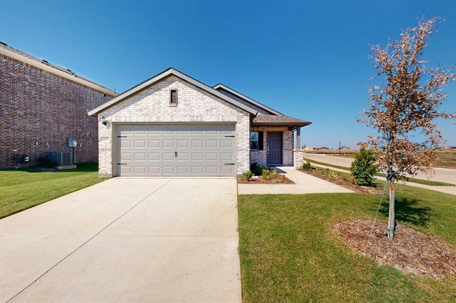 Front exterior of a new home in Mobberly Farms, Pilot Point, TX, highlighting curb appeal (Image 2).
