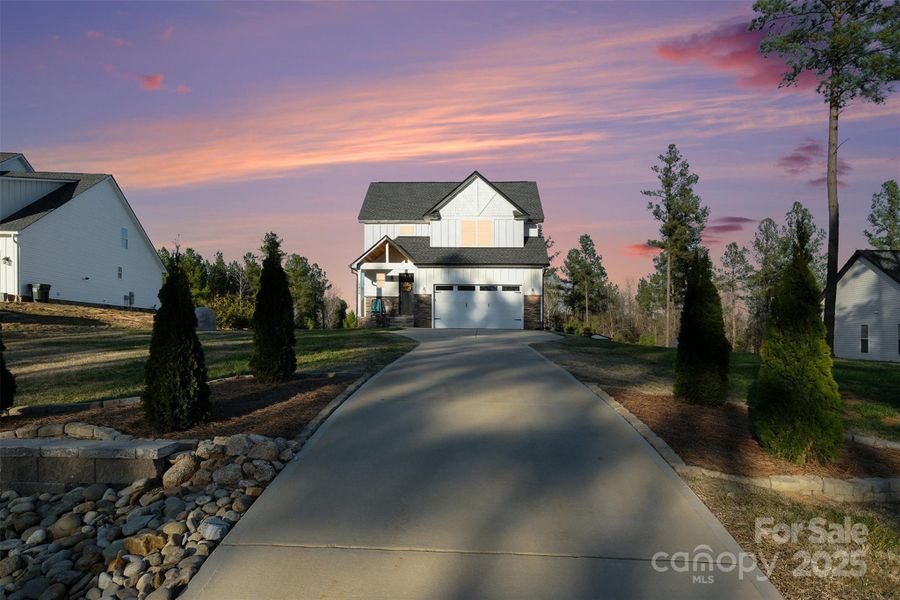 Front exterior of a new home in , Clover, SC, highlighting curb appeal (Image 21).