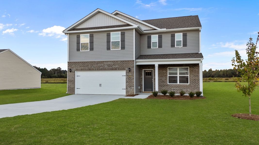 Front exterior of a new home in Beaver Dam Crossing, Bailey, NC, highlighting curb appeal (Image 17).