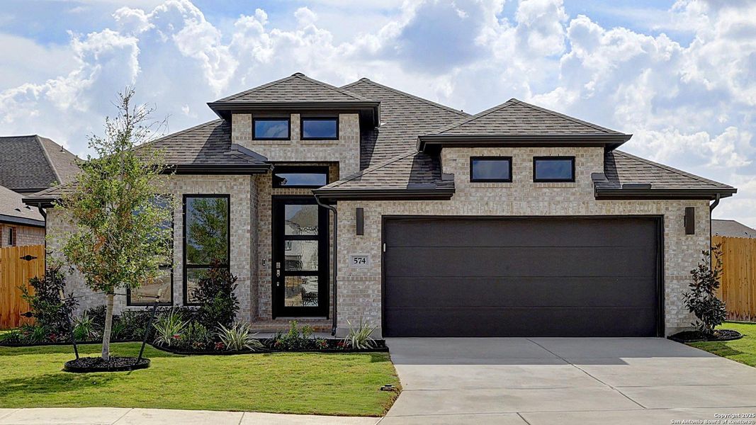 Front exterior of a new home in Alsatian Oaks 50', Castroville, TX, highlighting curb appeal (Image 1). Front exterior of a new home in Alsatian Oaks 50', Castroville, TX, highlighting curb appeal (Image 1).