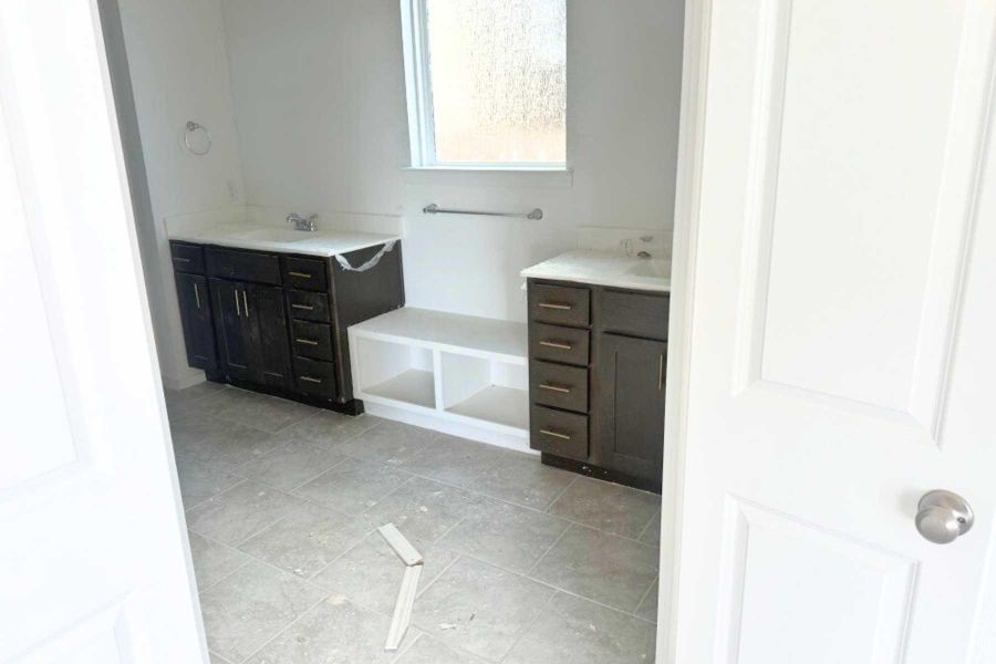 Full bathroom featuring two vanities Full bathroom featuring two vanities