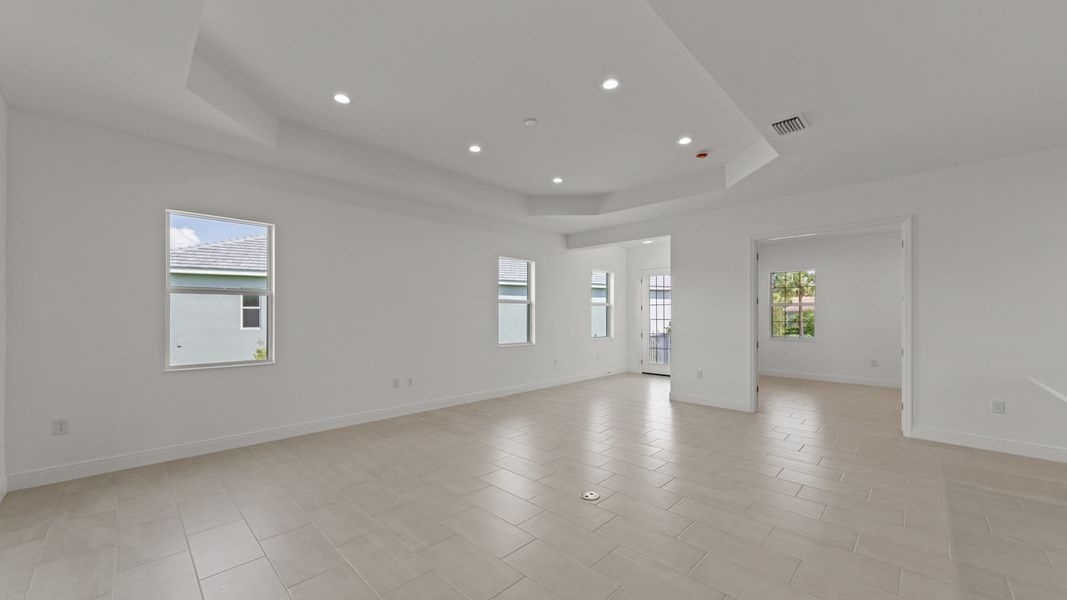 Spacious, unfurnished interior of a new home in Verandah Real Estate and Homes for Sale in Fort Myers, FL - Neal Communities, Fort Myers (Image 14).