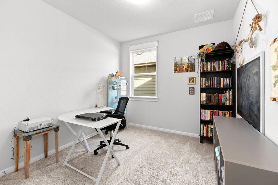 Secondary bedroom currently used as office space Secondary bedroom currently used as office space