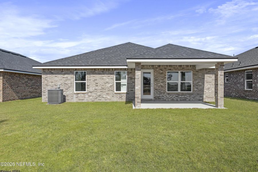 Exterior details and patio area of a home in Shadow Crest at Rolling Hills, Green Cove Springs (Image 3).