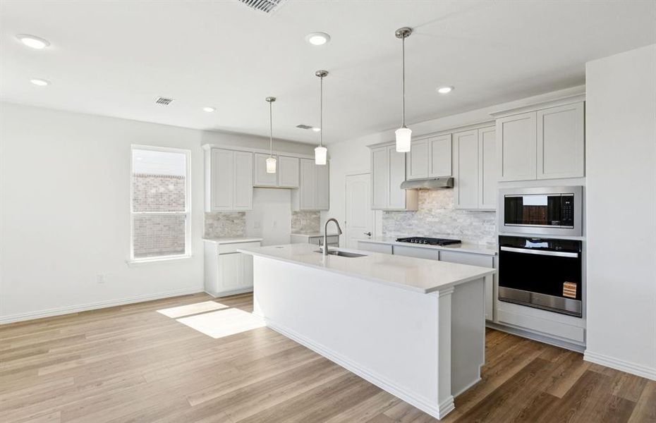 Spacious kitchen with eat-in bartop island