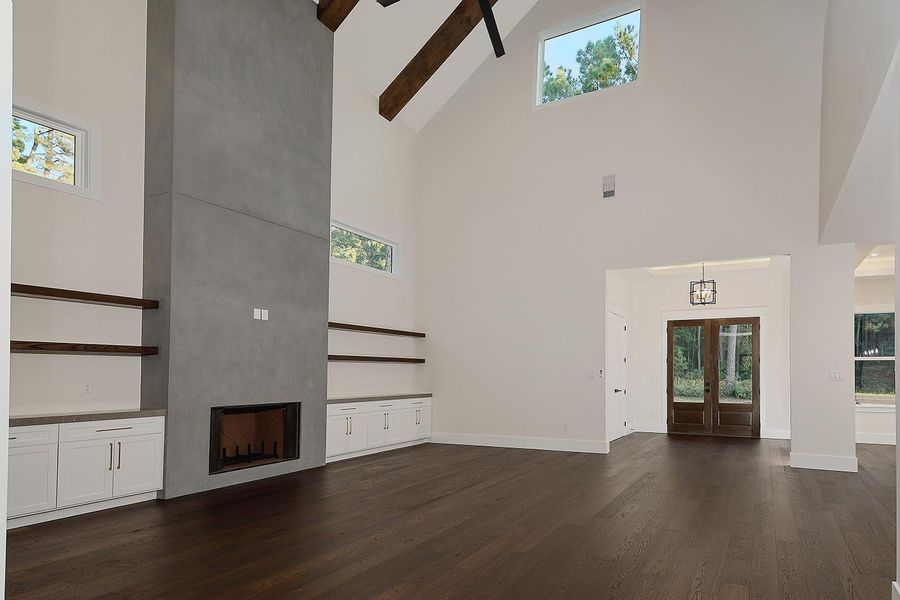 Generous Family Room With Fireplace, Shelving and Cabinetry Generous Family Room With Fireplace, Shelving and Cabinetry