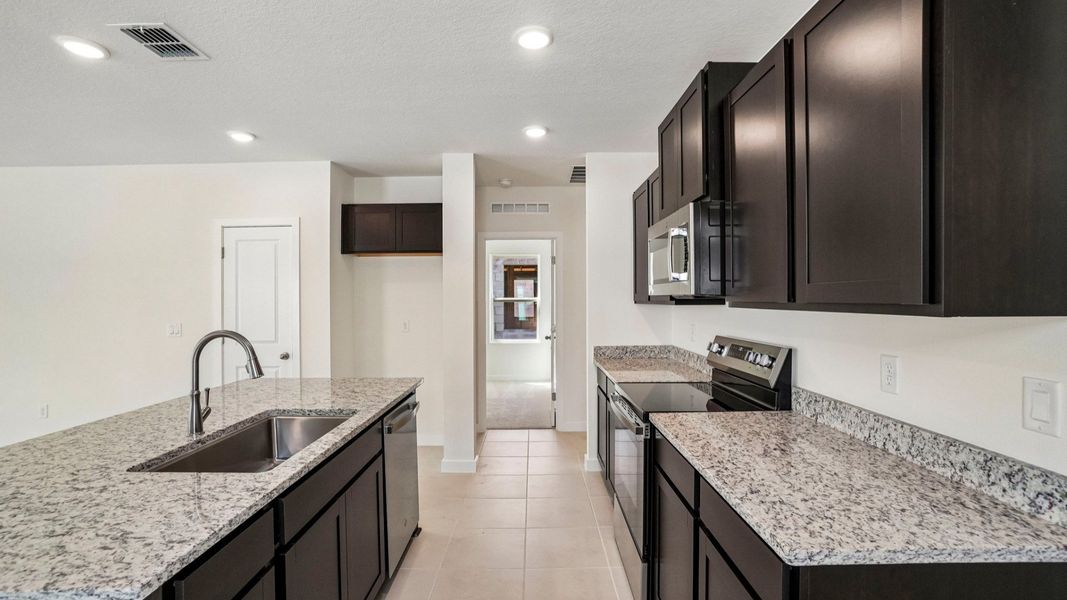 Furnished interior view inside a new home in Willowbrook North, Winter Haven (Image 12).