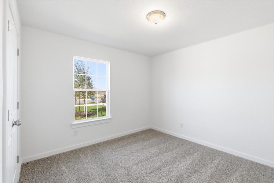 Unfurnished room with carpet and baseboards