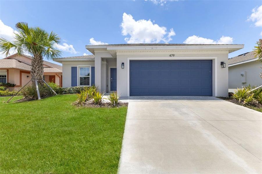 Front exterior of a new home in , Port Charlotte, FL, highlighting curb appeal (Image 23).