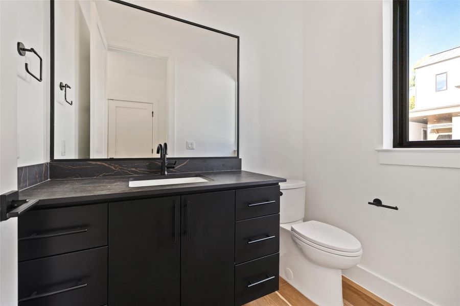 Bathroom featuring wood finished floors and vanity