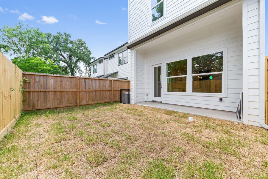 Fully fenced yard offering privacy, security, and plenty of space for outdoor activities.