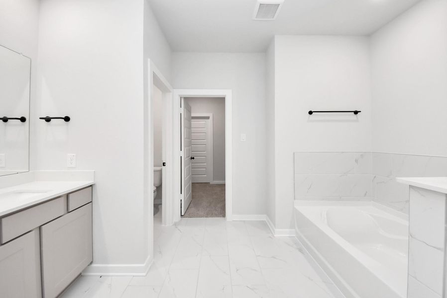 Furnished interior view inside a new home in Enclave at Newport, Crosby (Image 15).