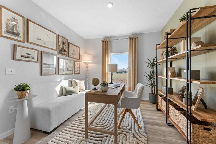 A room with a bed and a table.