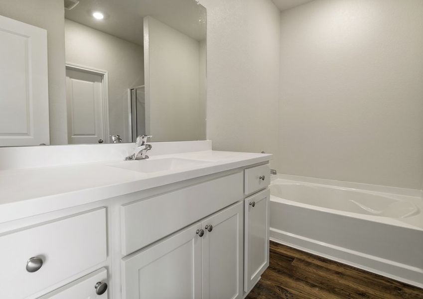 Master bathroom with a shower/tub combination