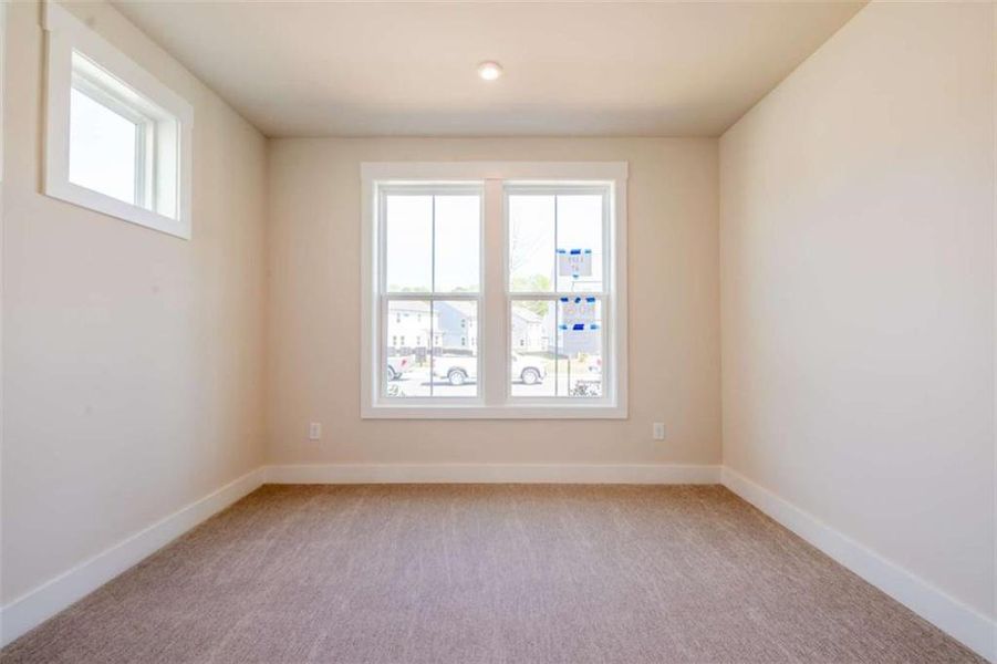 Spacious, unfurnished interior of a new home in The Paddocks at Doc Hughes, Buford (Image 23).