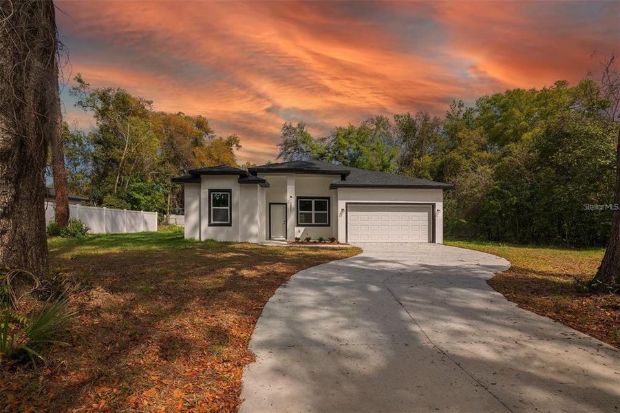 Front exterior of a new home in , Ocala, FL, highlighting curb appeal (Image 2). Front exterior of a new home in , Ocala, FL, highlighting curb appeal (Image 2).