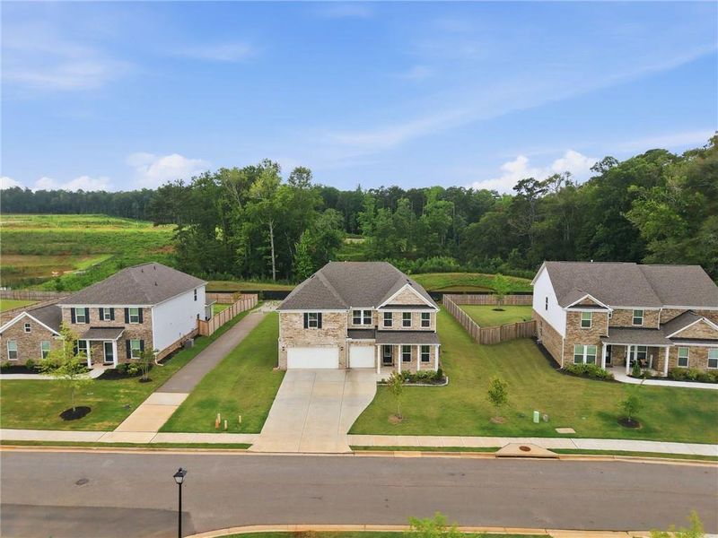 Front exterior of a new home in , McDonough, GA, highlighting curb appeal (Image 1). Front exterior of a new home in , McDonough, GA, highlighting curb appeal (Image 1).